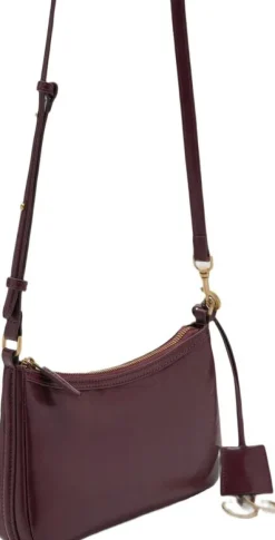Crossbody bag with charms and rings